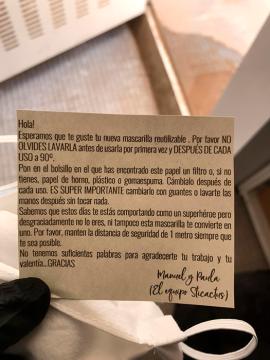 The masks contain a message of support