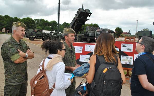 Colonel Santos and the journalists during the exhibition