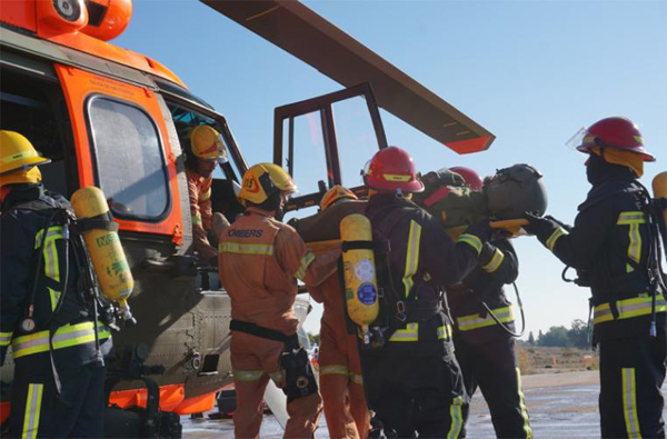 Simulated injured pilot being evacuated by helicopter