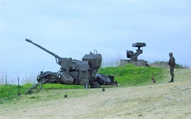 Cañón 35/90mm con su dirección de tiro.